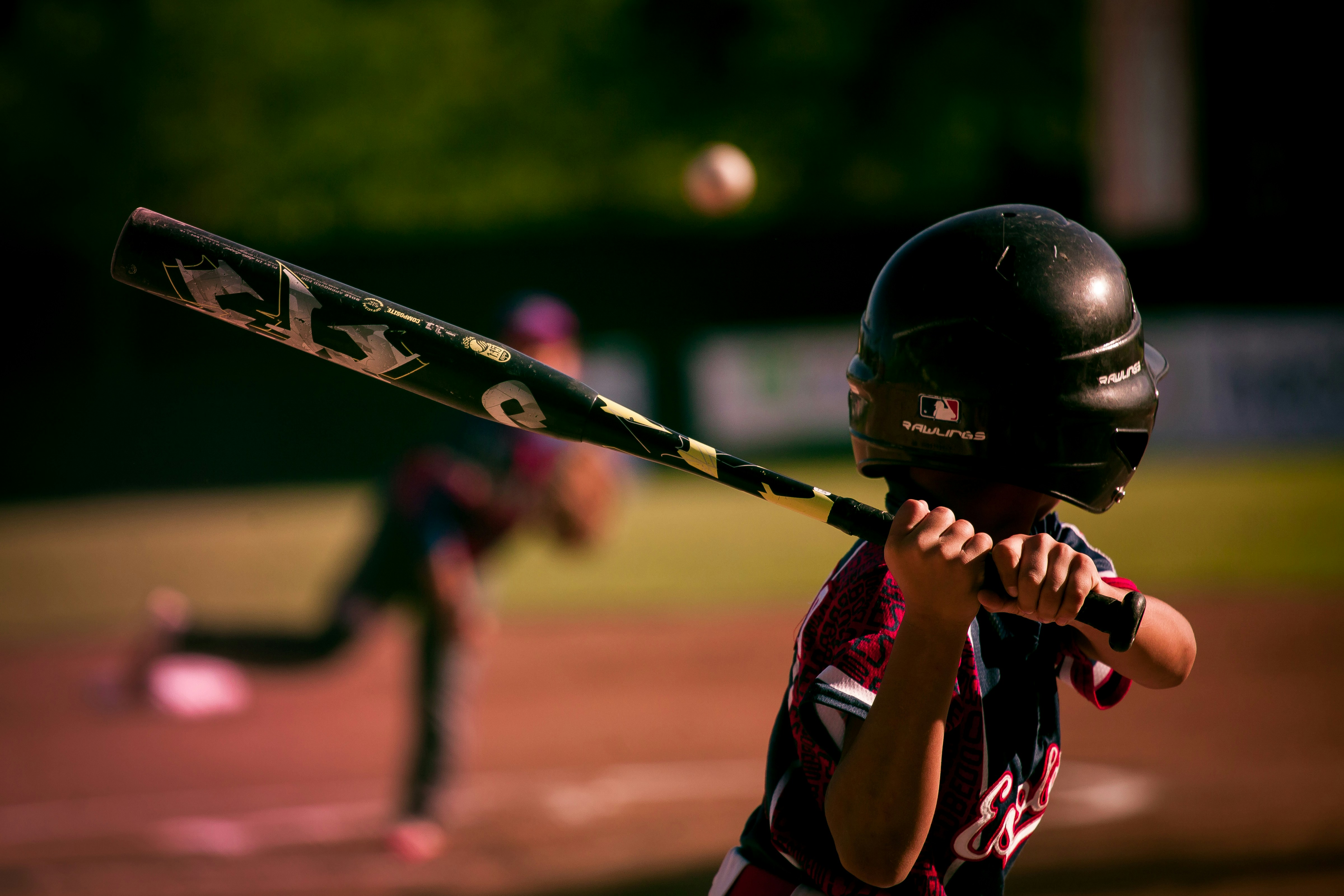 young child practicing baseball